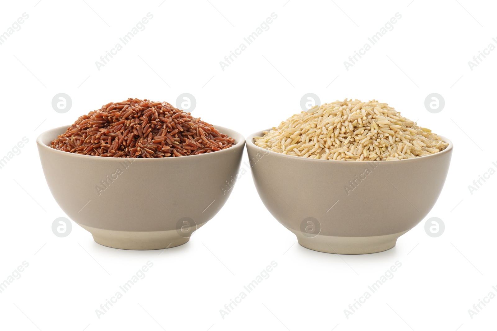 Photo of Different sorts of raw brown rice isolated on white