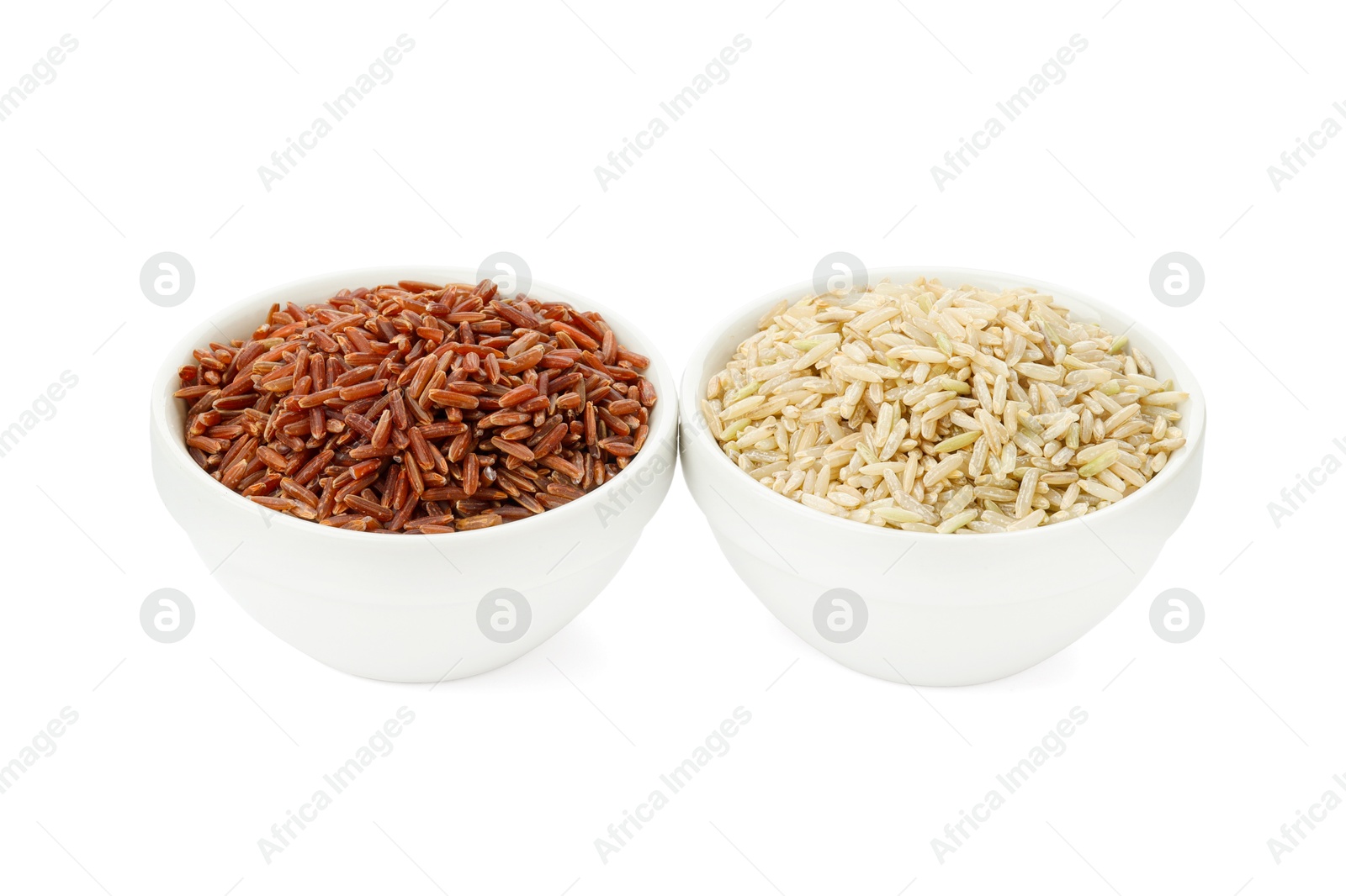 Photo of Different sorts of raw brown rice isolated on white