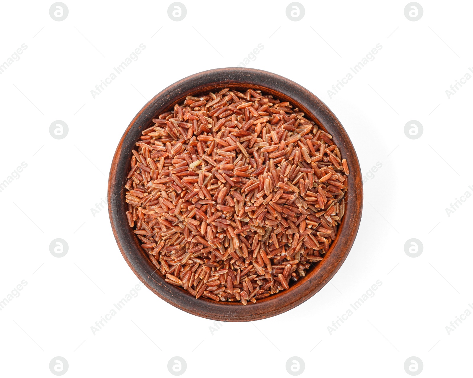 Photo of Raw brown rice in bowl isolated on white, top view