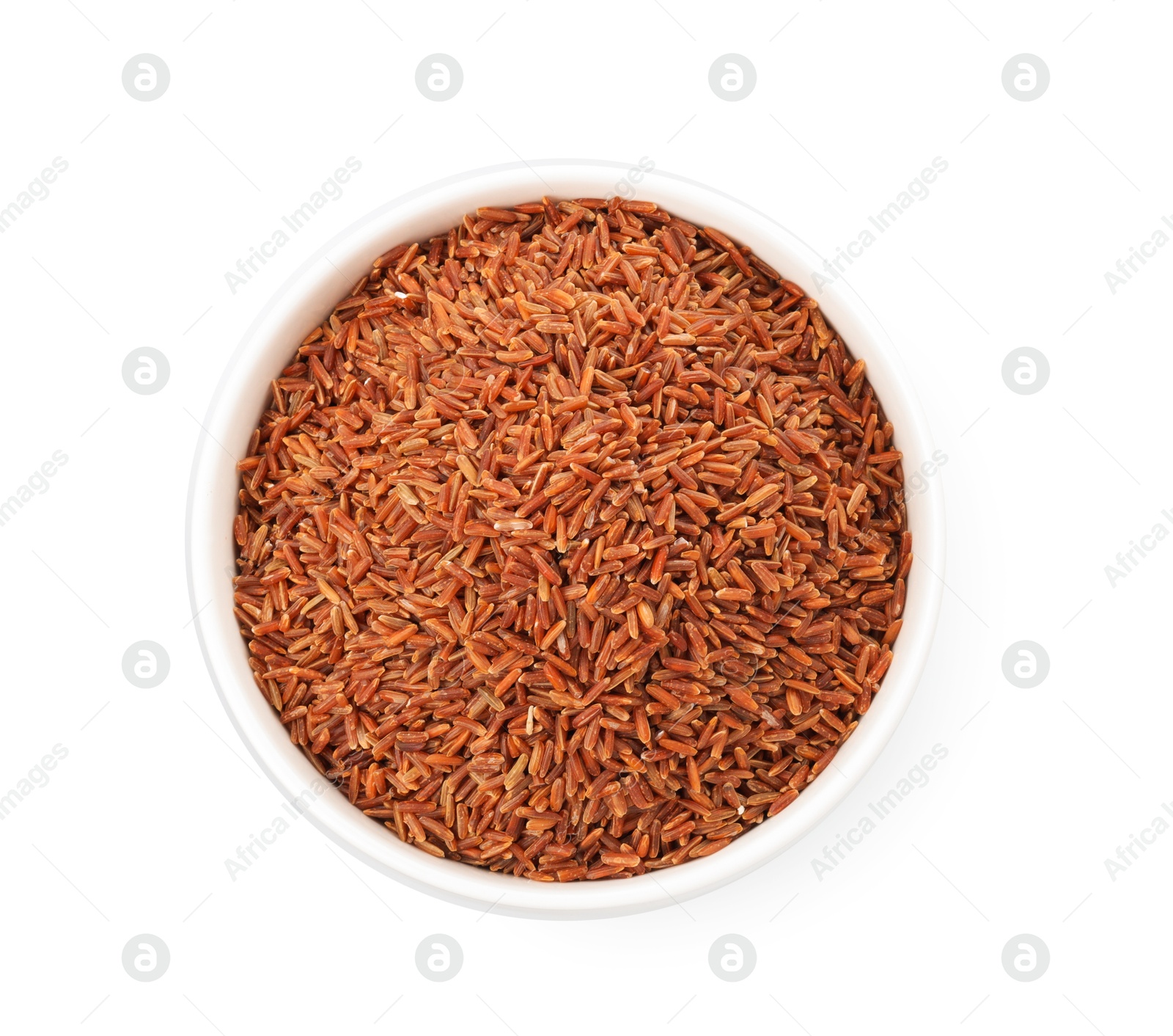 Photo of Raw brown rice in bowl isolated on white, top view