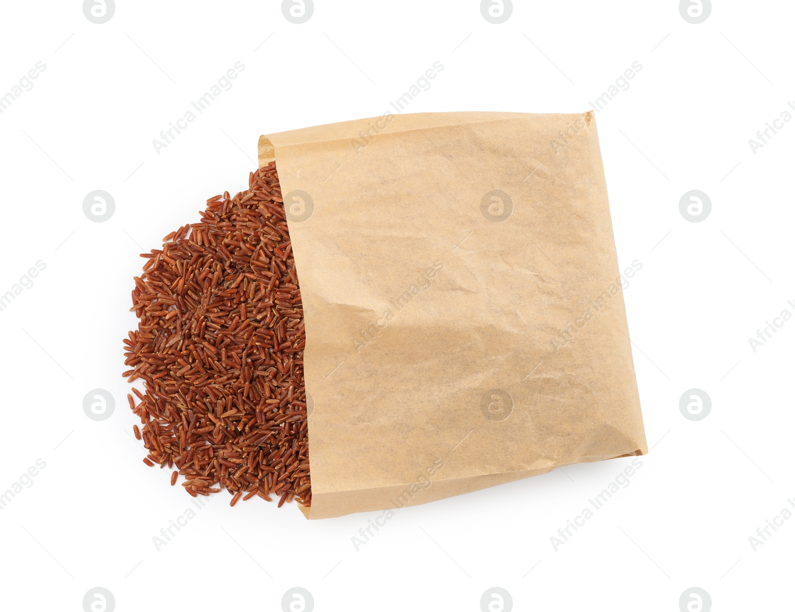 Photo of Raw brown rice in paper bag isolated on white, top view