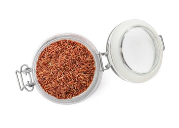 Photo of Raw brown rice in open jar isolated on white, top view