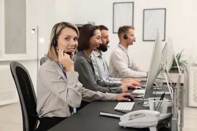 Technical support call center. Team of operators working in office