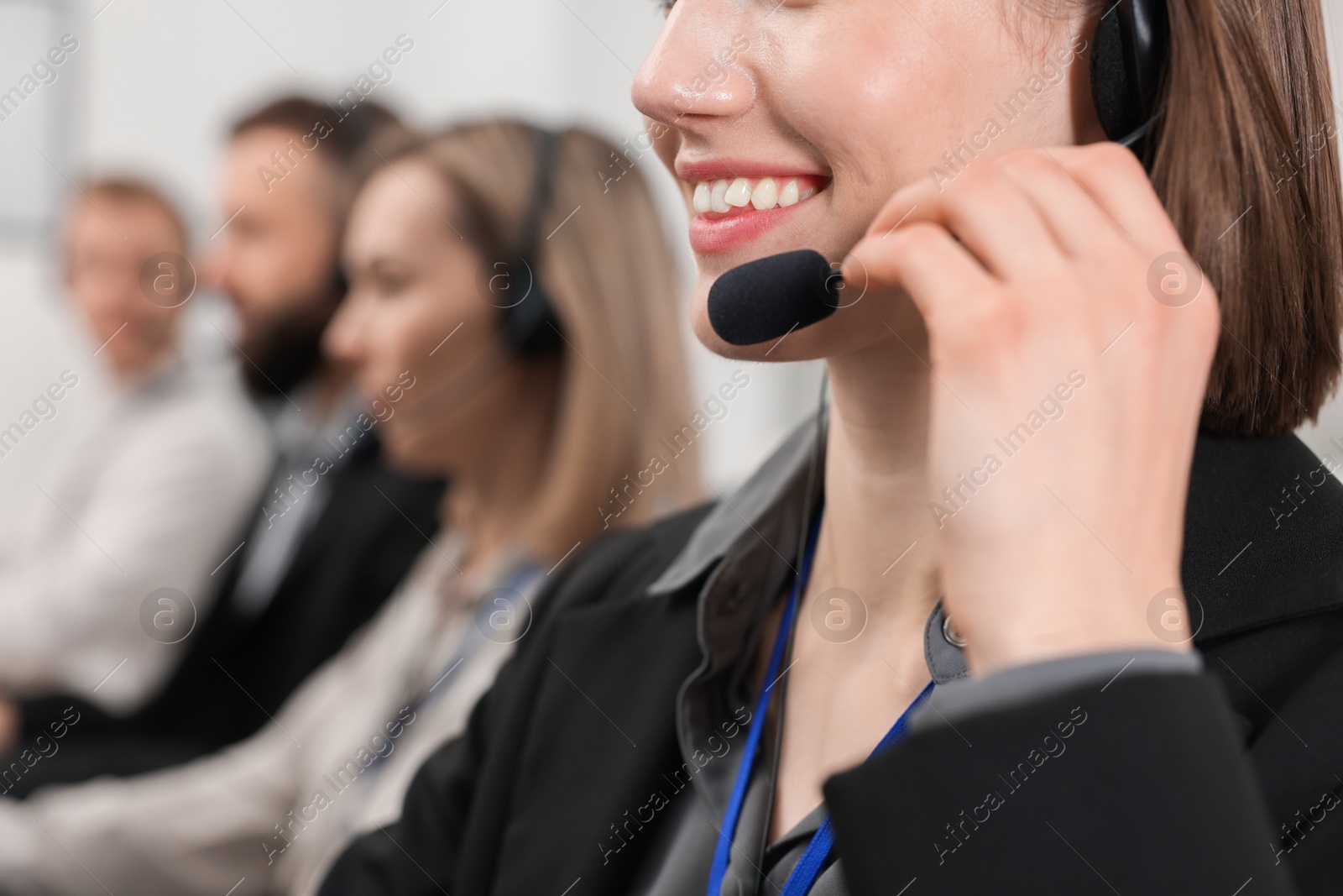 Photo of Technical support call center. Team of operators working in office, selective focus