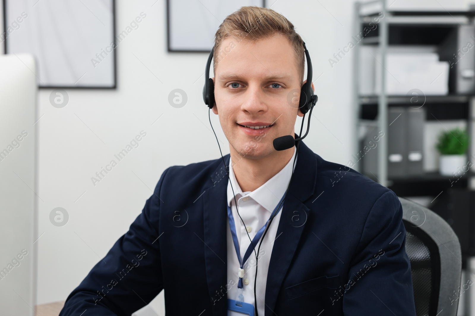 Photo of Technical support call center. Portrait of smiling operator in office