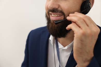 Photo of Technical support call center. Smiling operator working indoors, closeup. Space for text