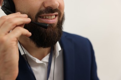 Photo of Technical support call center. Smiling operator working indoors, closeup. Space for text