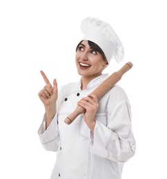 Photo of Professional chef with rolling pin pointing at something on white background