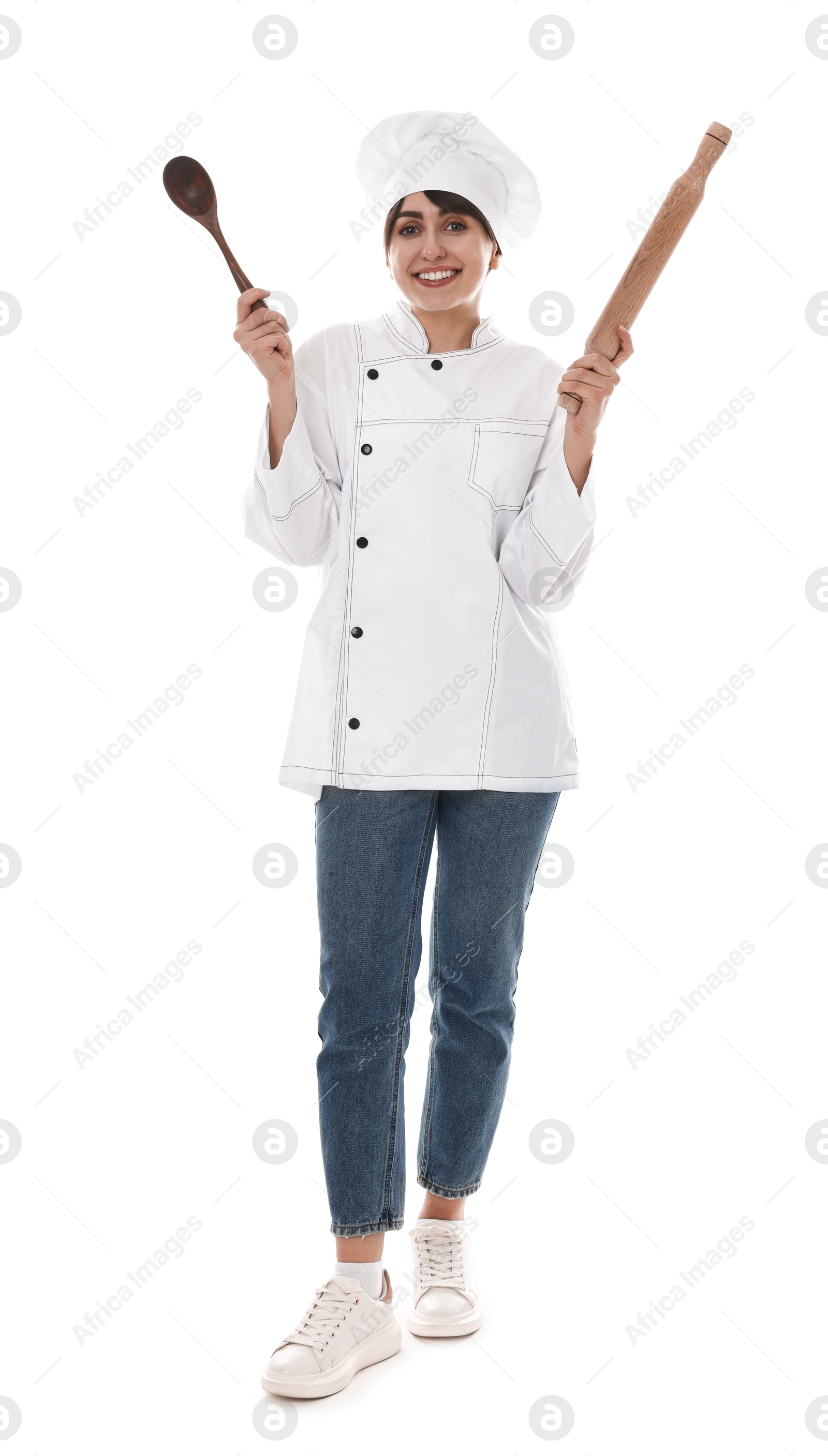 Photo of Professional chef with rolling pin and spoon on white background