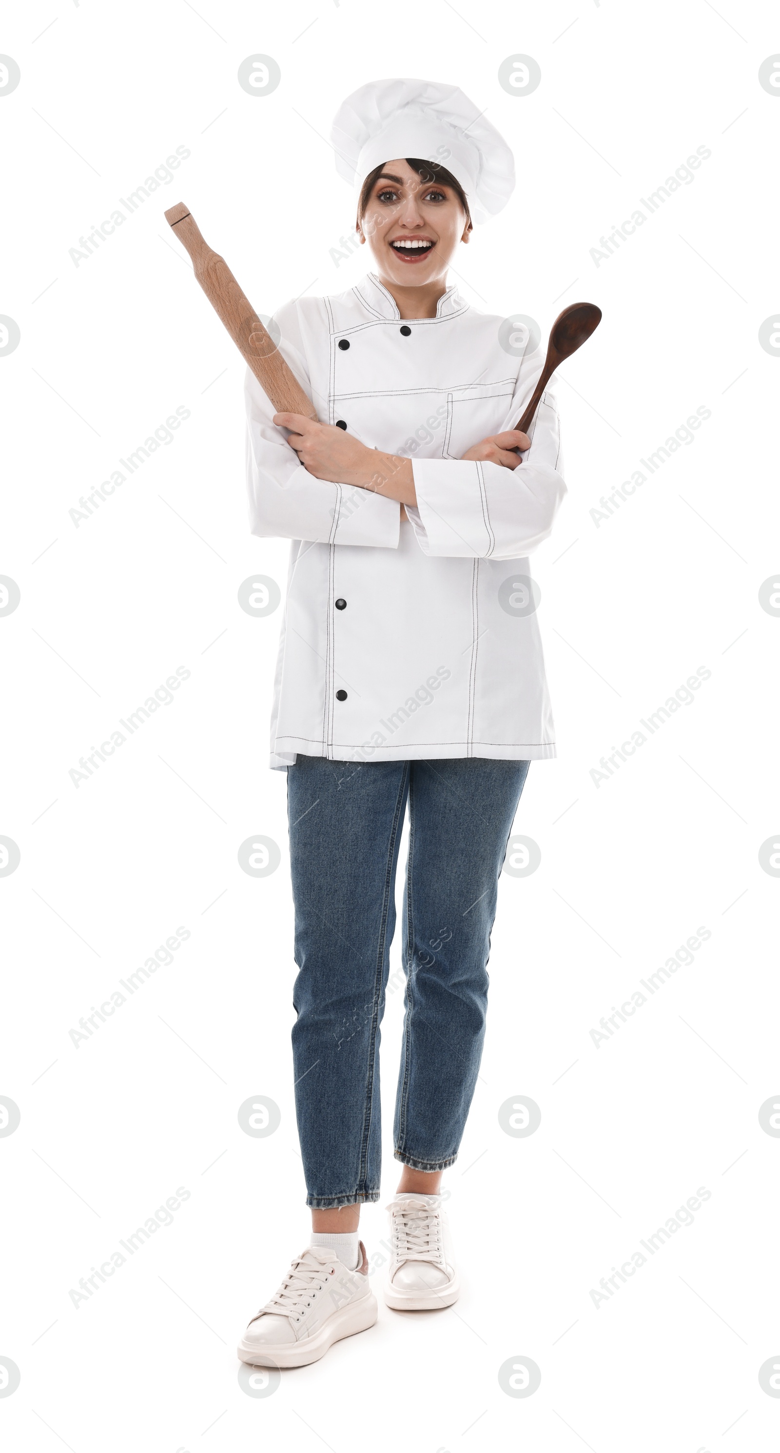 Photo of Professional chef with rolling pin and spoon on white background