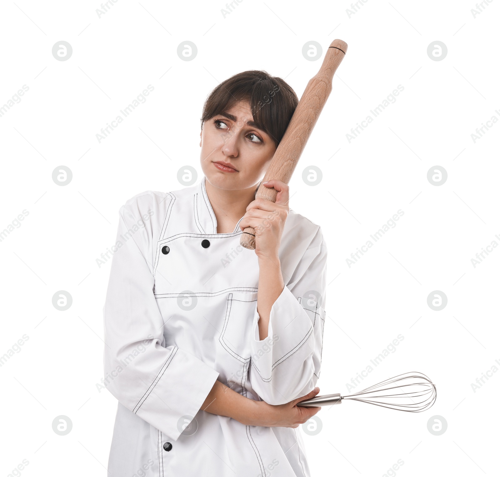 Photo of Sad chef with rolling pin and whisk on white background