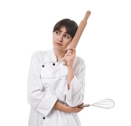 Photo of Sad chef with rolling pin and whisk on white background