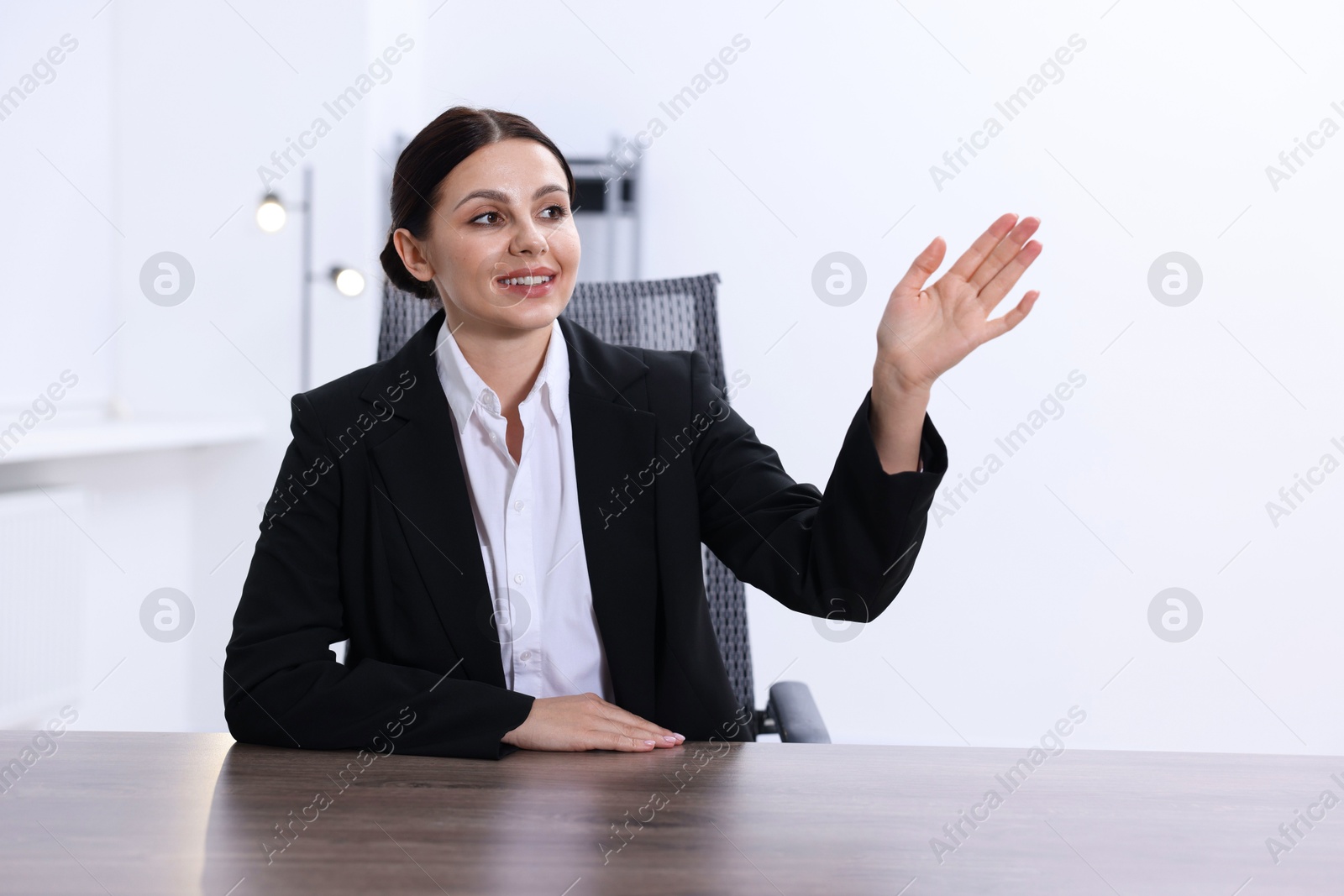 Photo of Beautiful woman looking at something in office