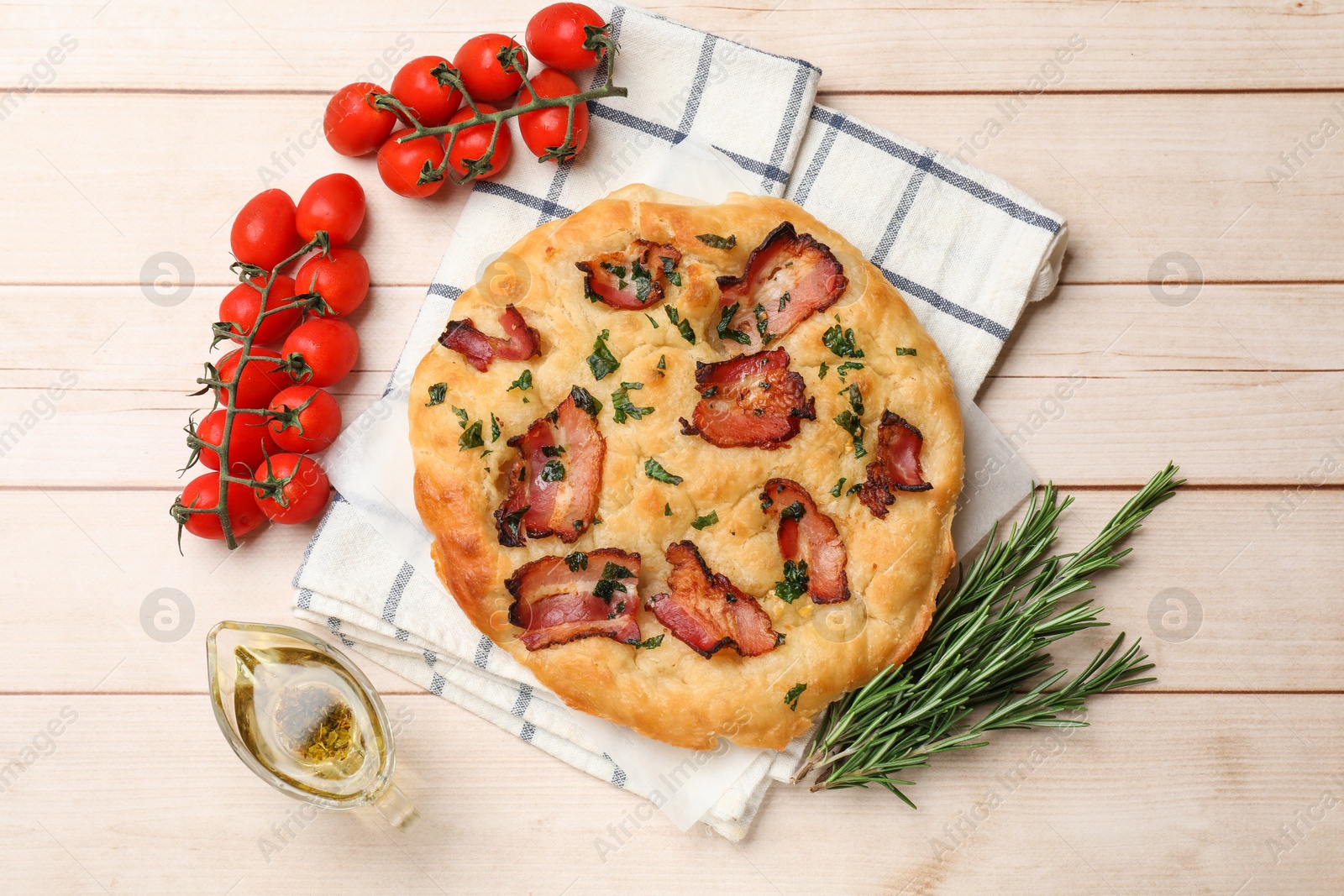 Photo of Delicious focaccia bread with bacon and parsley on white wooden table, flat lay