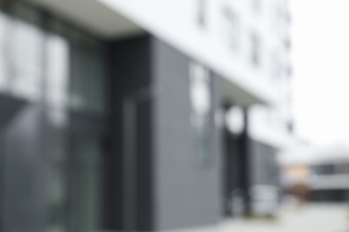 Photo of Blurred view of modern building with many windows outdoors