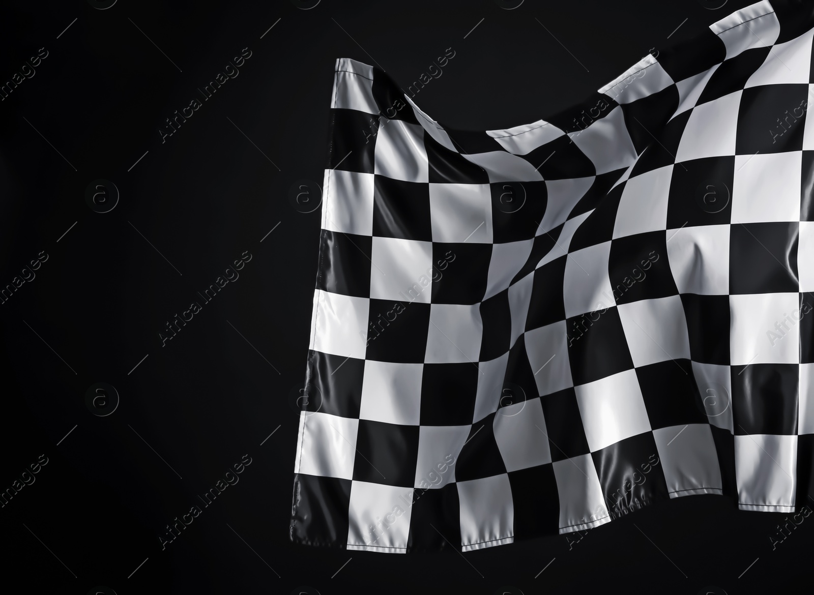 Photo of One racing checkered flag on black background, space for text