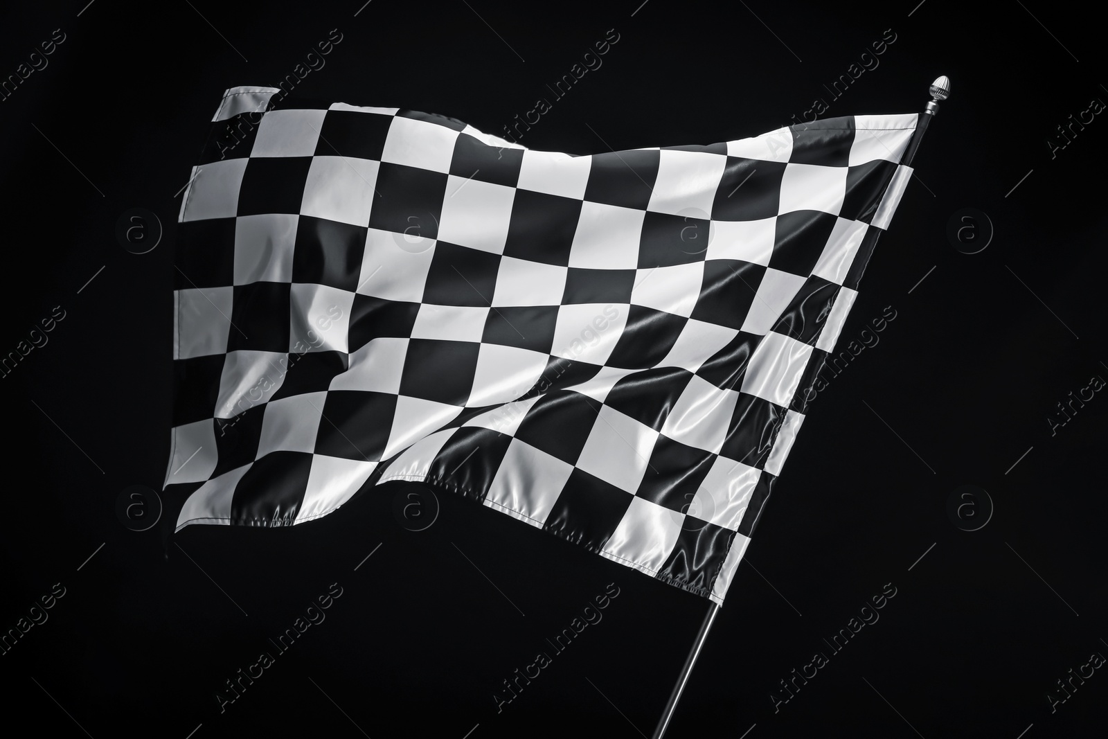 Photo of One racing checkered flag on black background