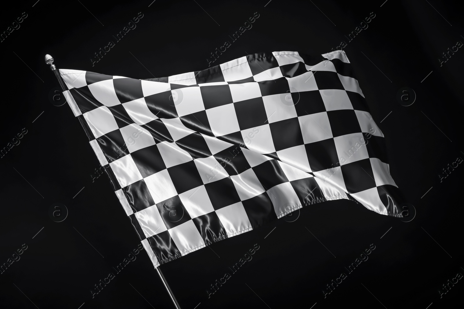 Photo of One racing checkered flag on black background