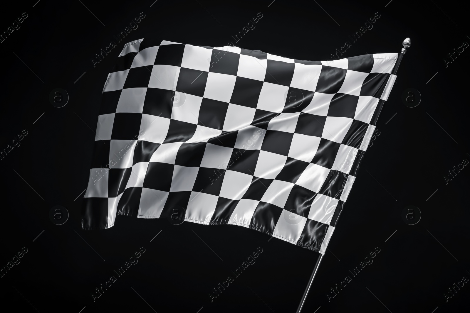 Photo of One racing checkered flag on black background