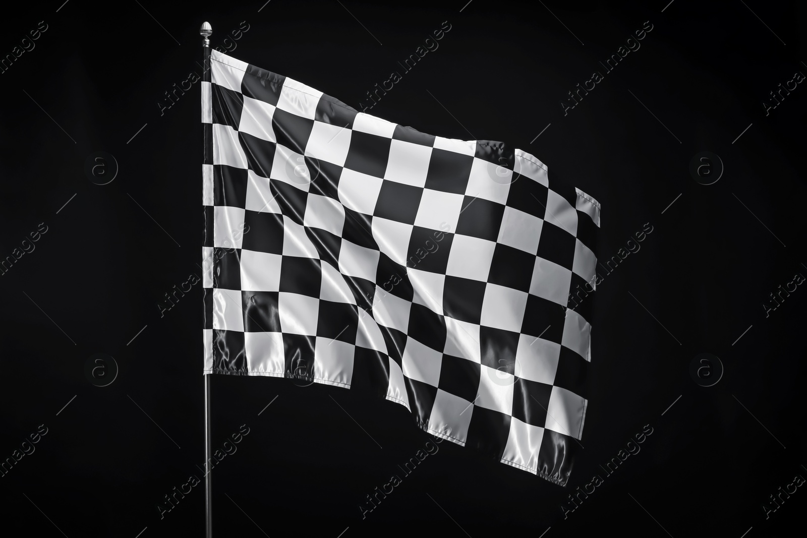 Photo of One racing checkered flag on black background