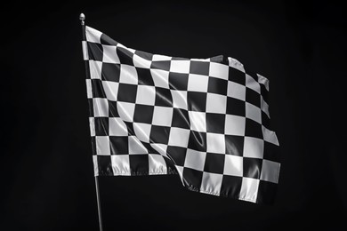 Photo of One racing checkered flag on black background