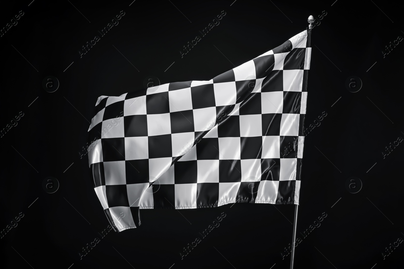 Photo of One racing checkered flag on black background