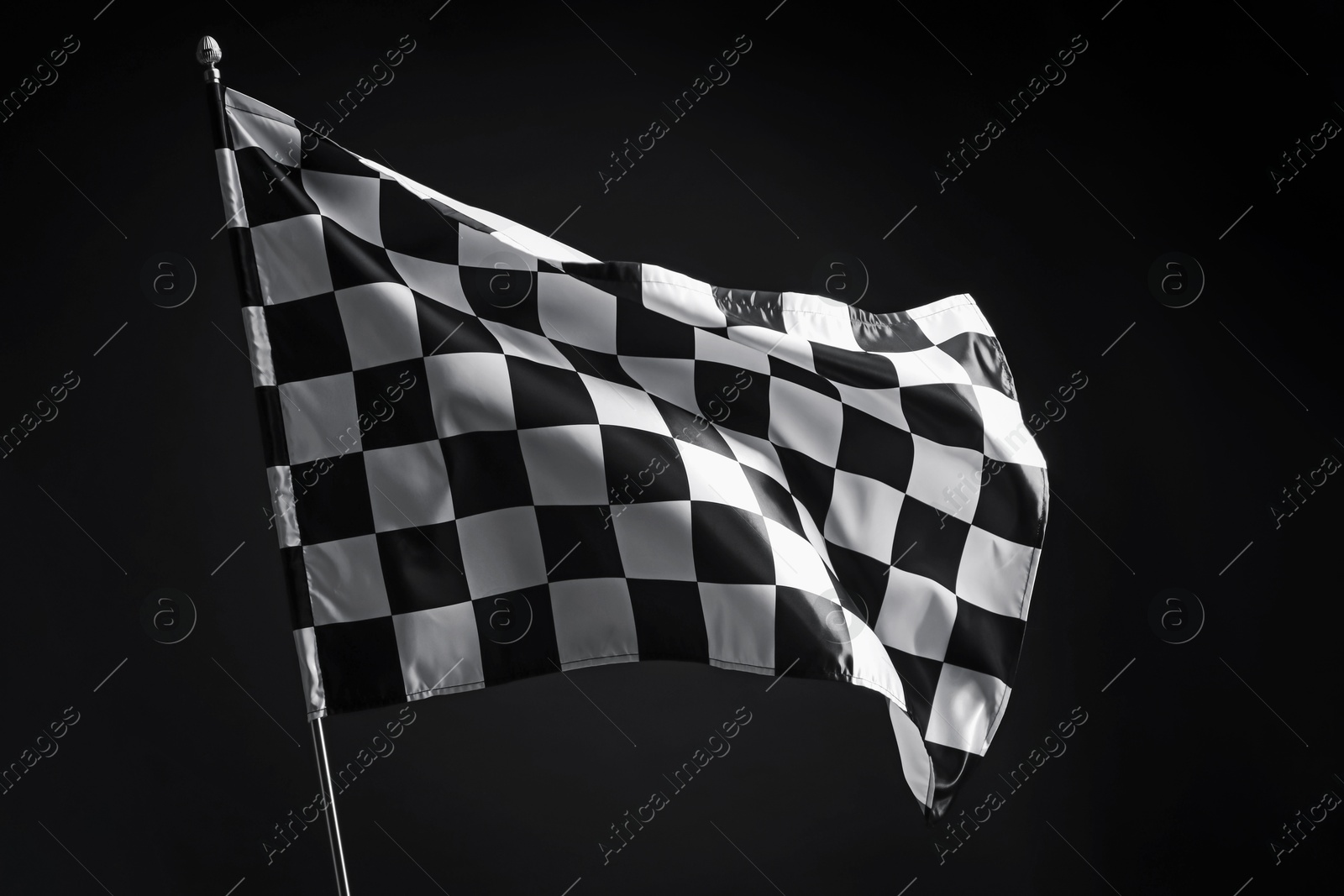 Photo of One racing checkered flag on black background