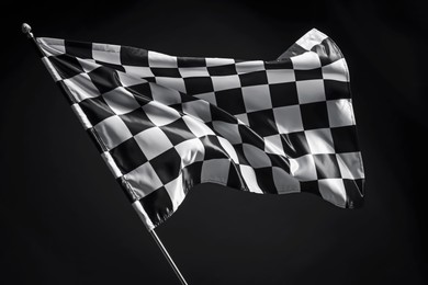 Photo of One racing checkered flag on black background