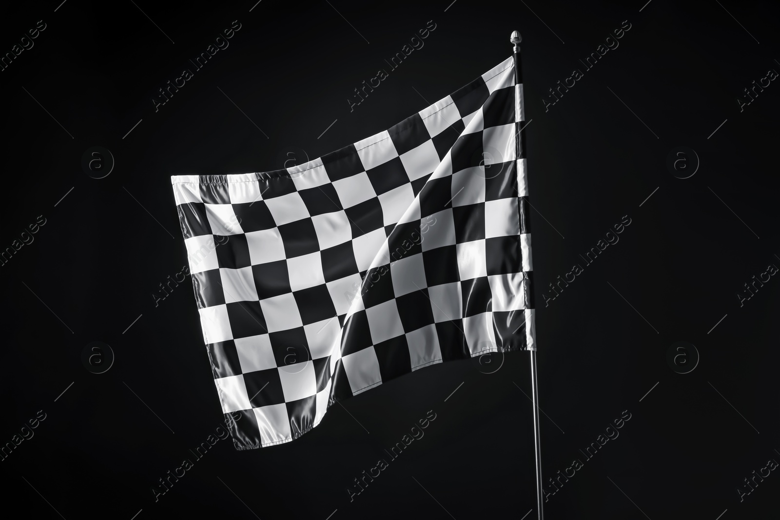 Photo of One racing checkered flag on black background