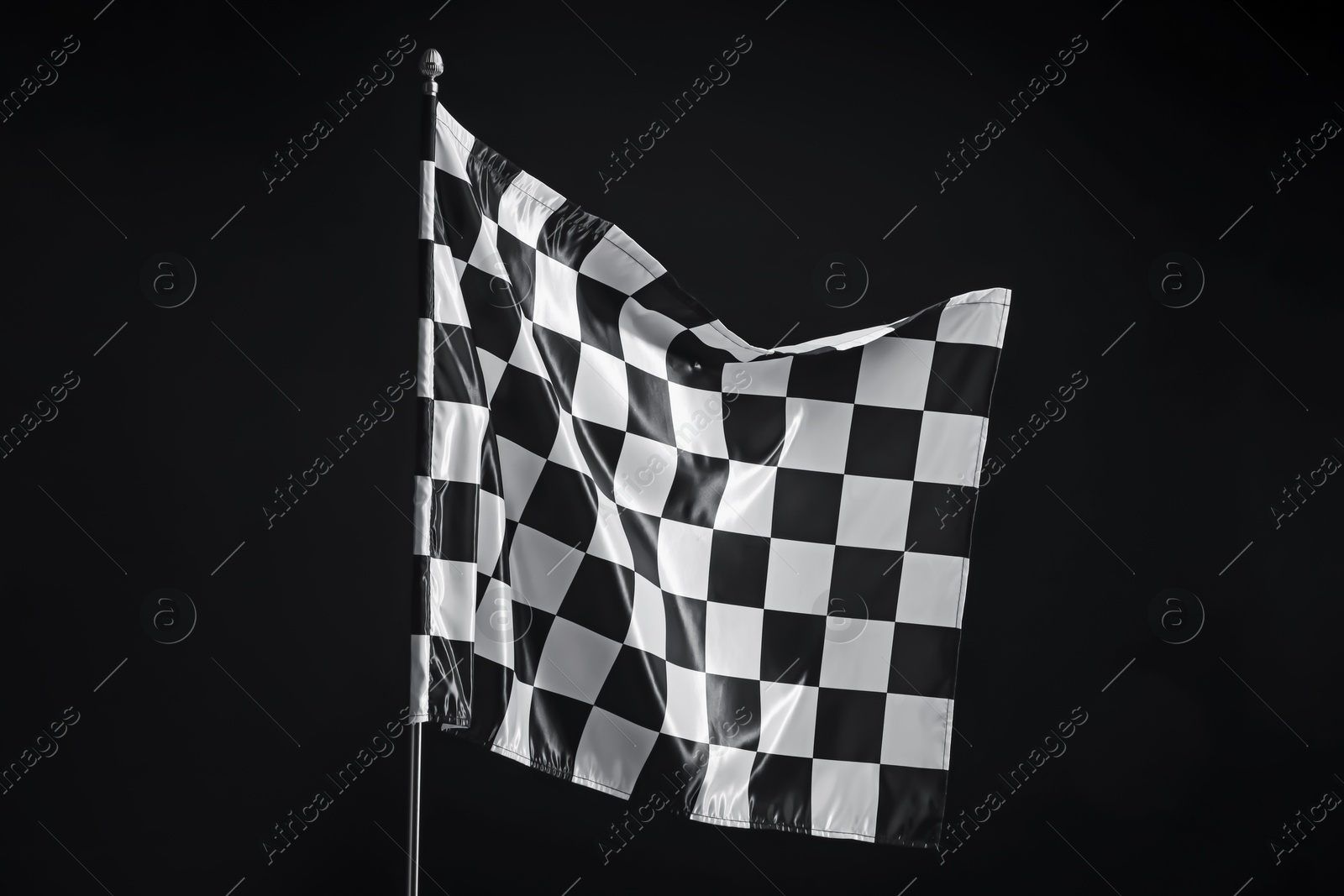 Photo of One racing checkered flag on black background