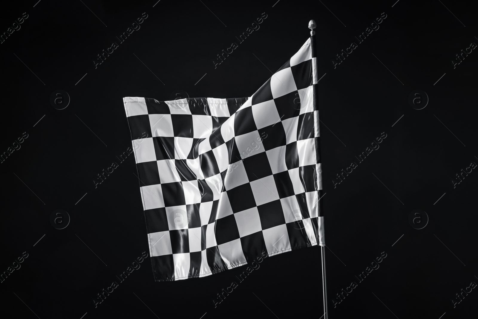 Photo of One racing checkered flag on black background