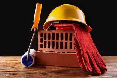 Photo of Different construction material and tools on wooden table