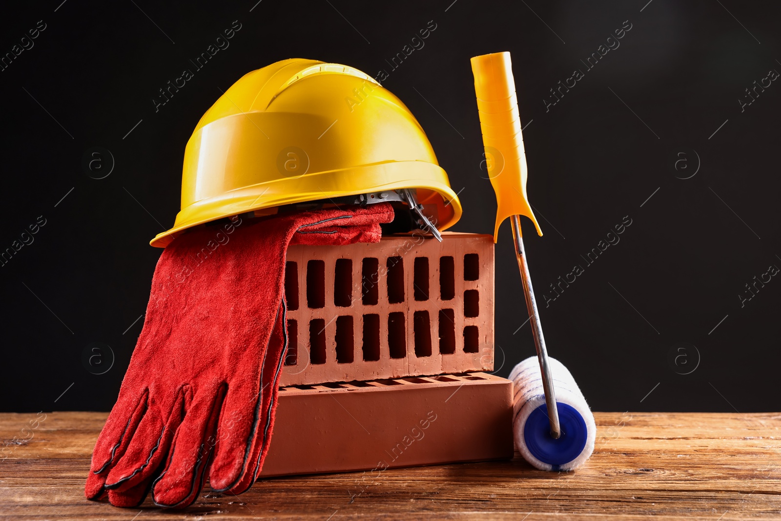 Photo of Different construction material and tools on wooden table