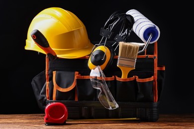 Photo of Different construction material and tools on wooden table