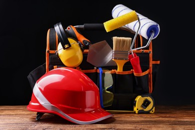 Photo of Different construction material and tools on wooden table