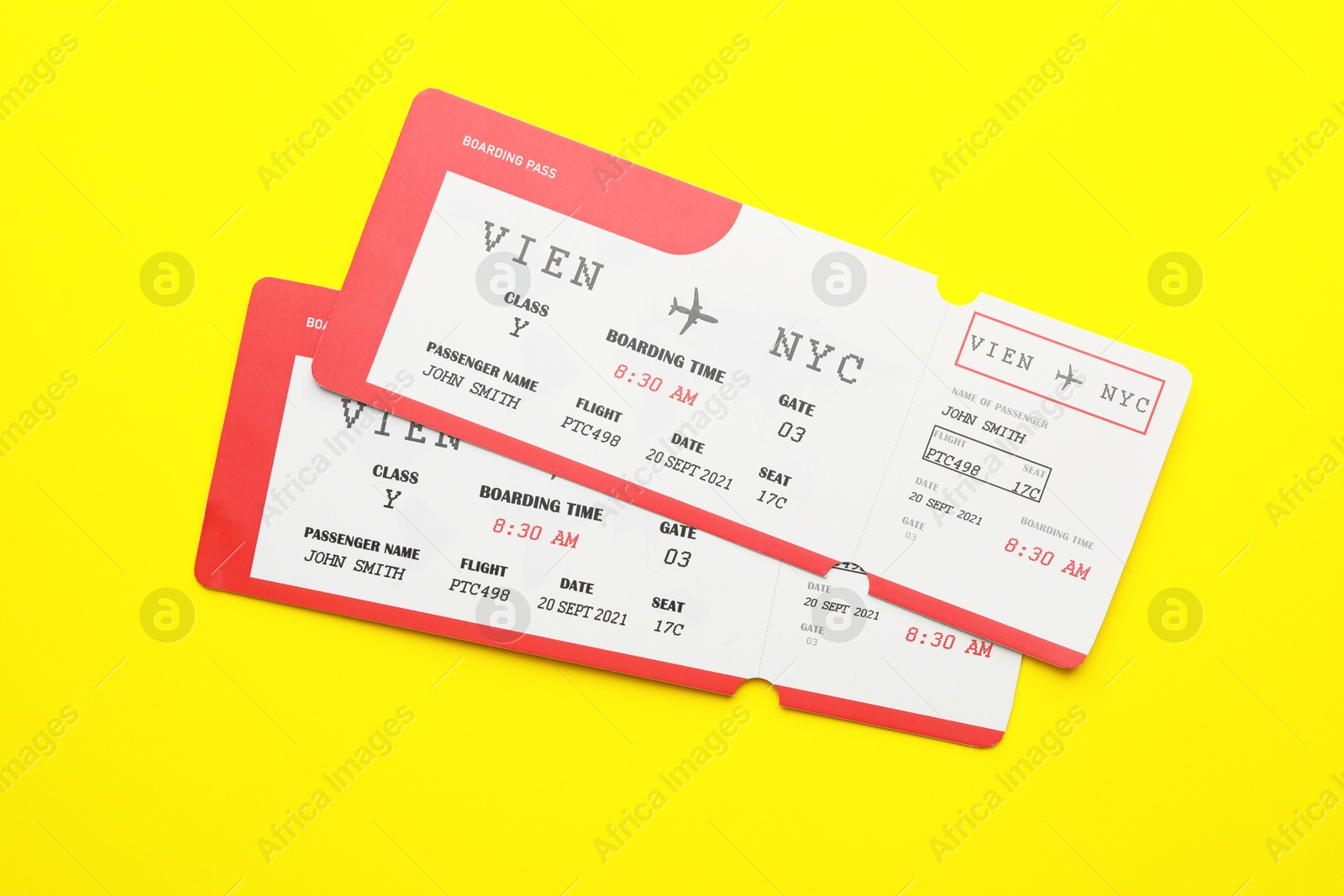 Photo of Travel agency. Flight tickets on yellow background, top view