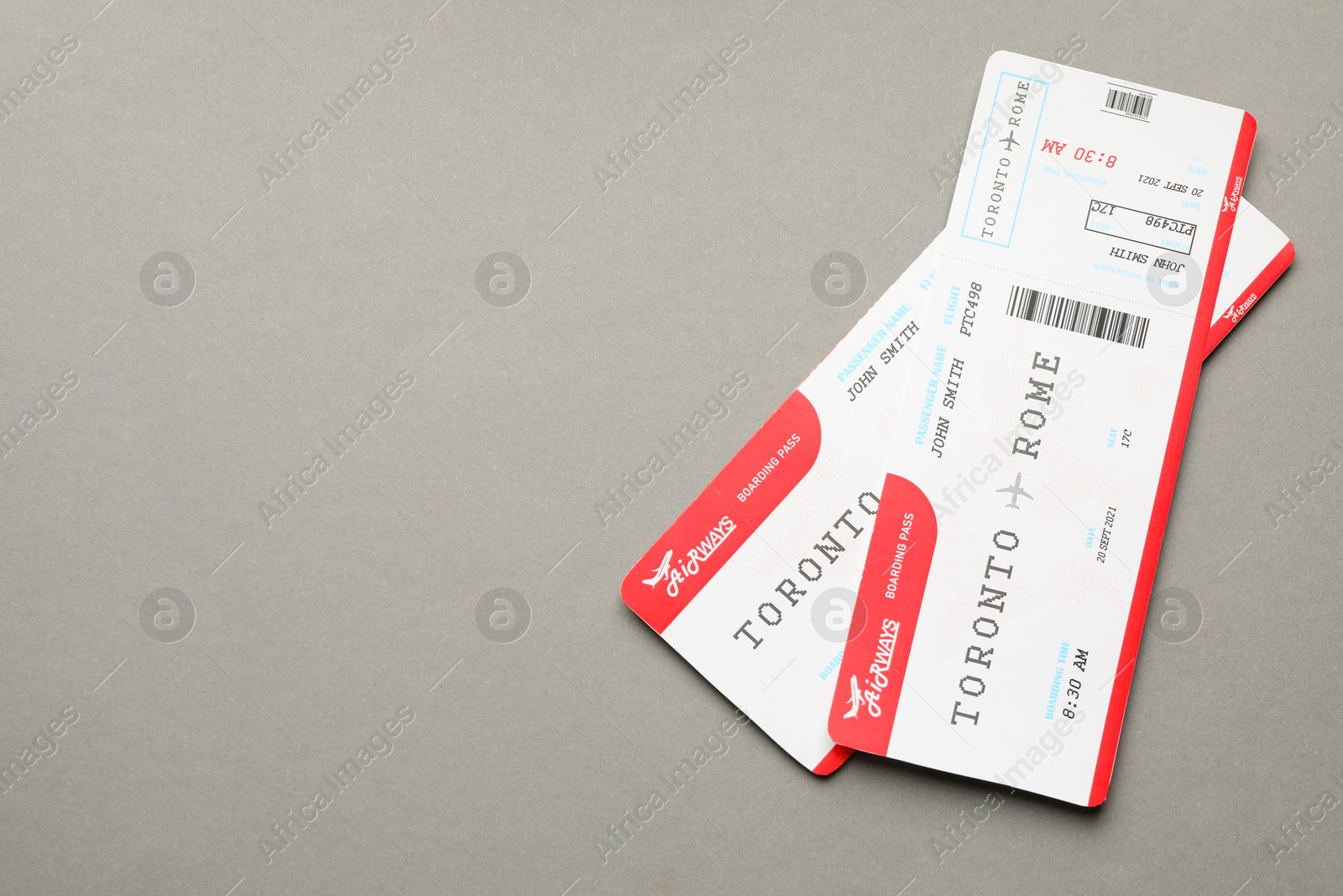 Photo of Travel agency. Flight tickets on grey background, top view. Space for text