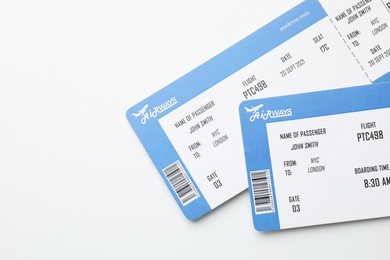 Photo of Travel agency. Flight tickets on light background, top view. Space for text