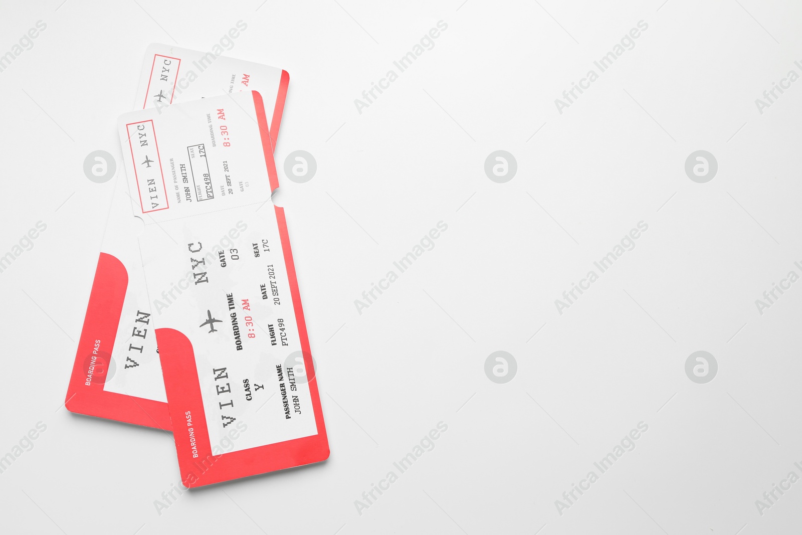 Photo of Travel agency. Flight tickets on light background, top view. Space for text