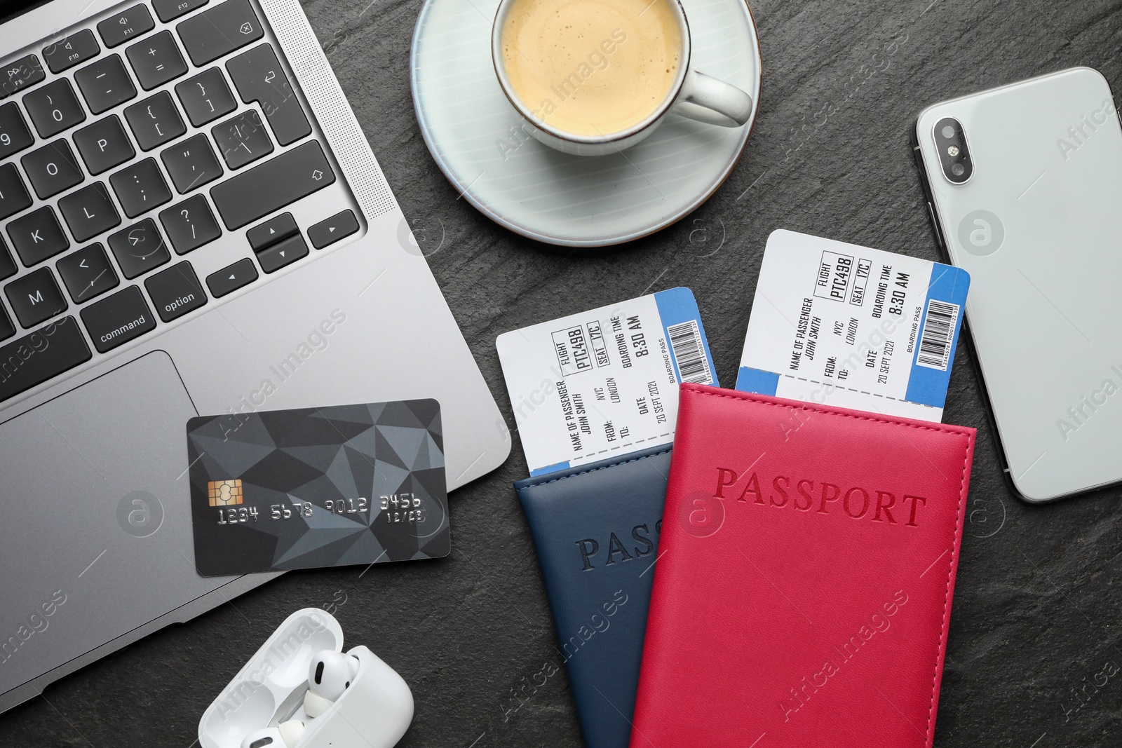 Photo of Travel agency. Flat lay composition with flight tickets and credit card on dark textured table