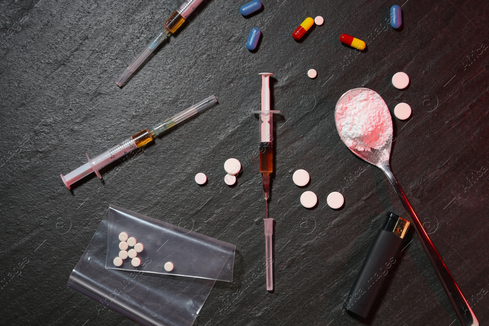 Photo of Flat lay composition with different drugs on dark gray textured table