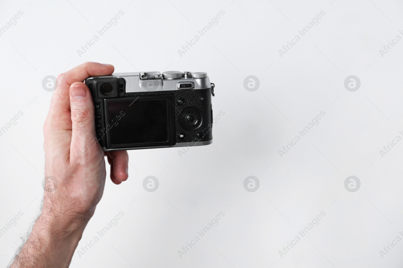 Photo of Photographer with vintage camera on white background, closeup. Space for text