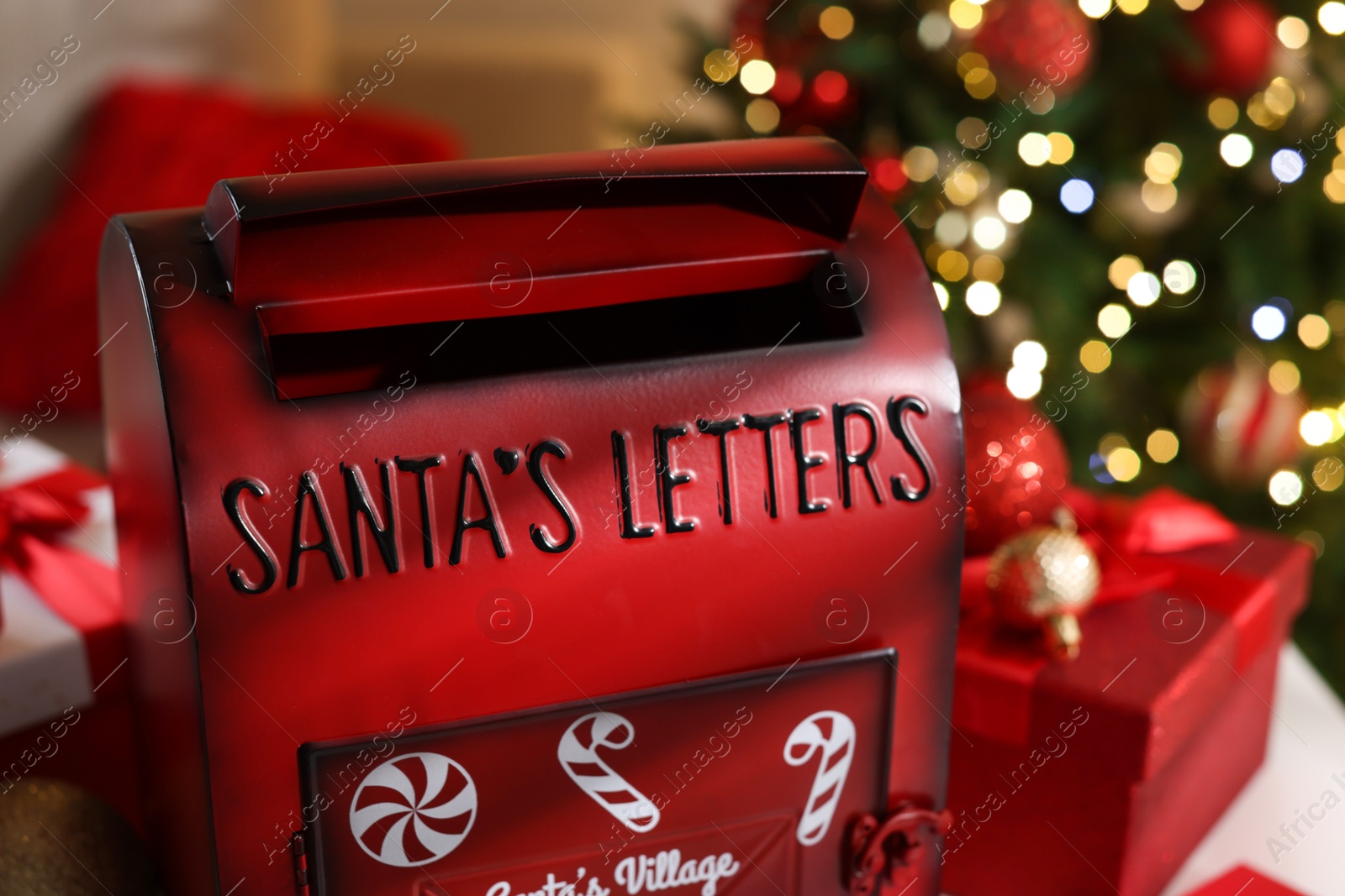 Photo of Santa Claus mailbox and Christmas decor indoors, closeup