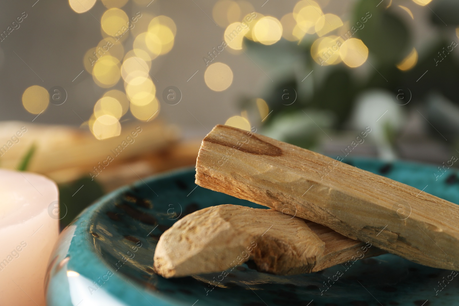 Photo of Palo santo sticks on table, closeup view