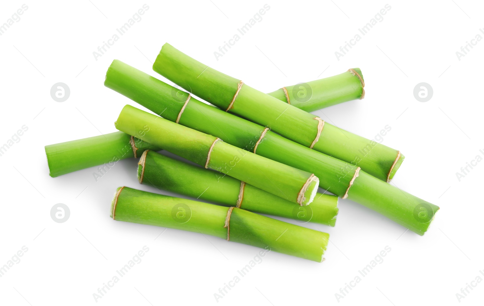 Photo of Cut green bamboo stems isolated on white, top view