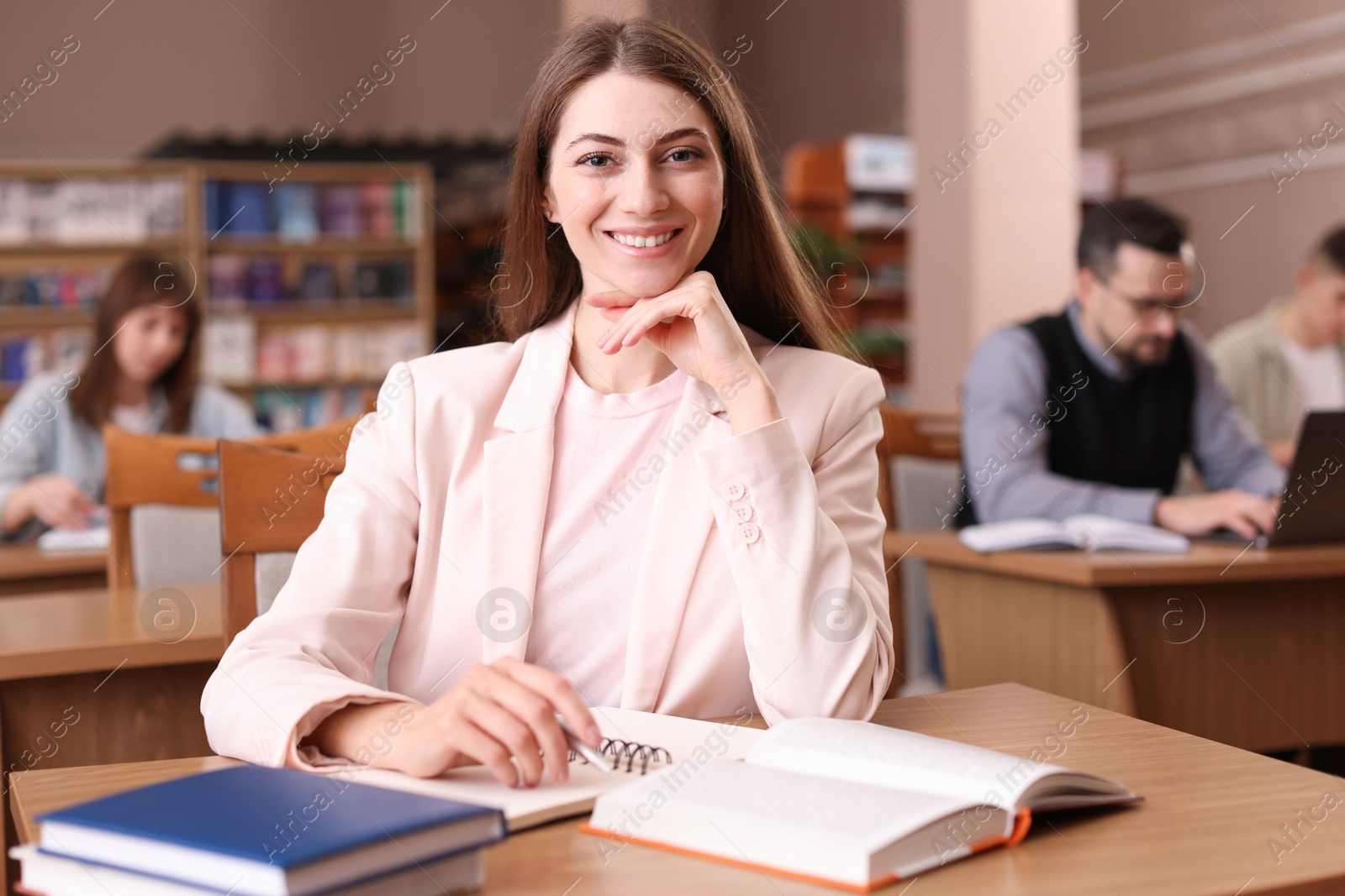 Photo of Portrait of smiling woman in public library