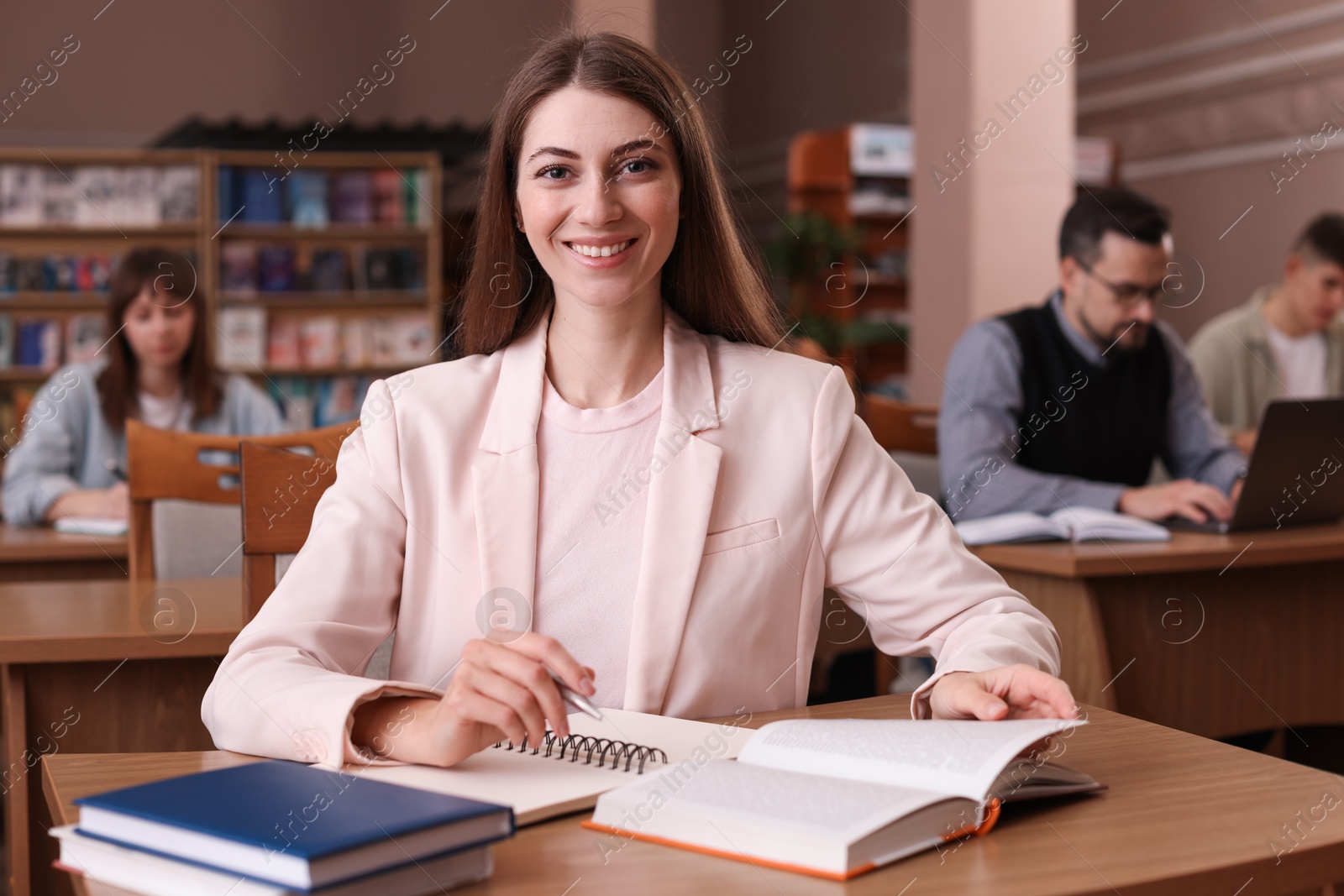 Photo of Portrait of smiling woman in public library