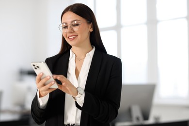 Photo of Banker using smartphone in office, space for text