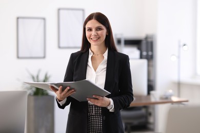 Photo of Portrait of banker with folder in office