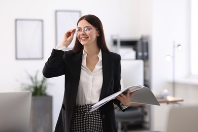 Photo of Portrait of banker with folder in office